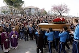 First victims buried: A coffin is carried from a church in Loreto Aprutino, 130km north of L'Aquila.