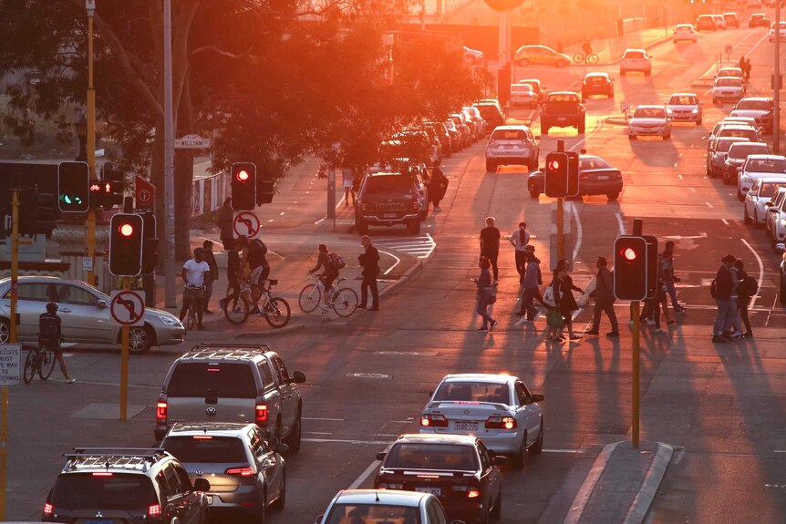 As the sun sets on Roe St, cars, bicycles and pedestrians filled the road and footpaths.