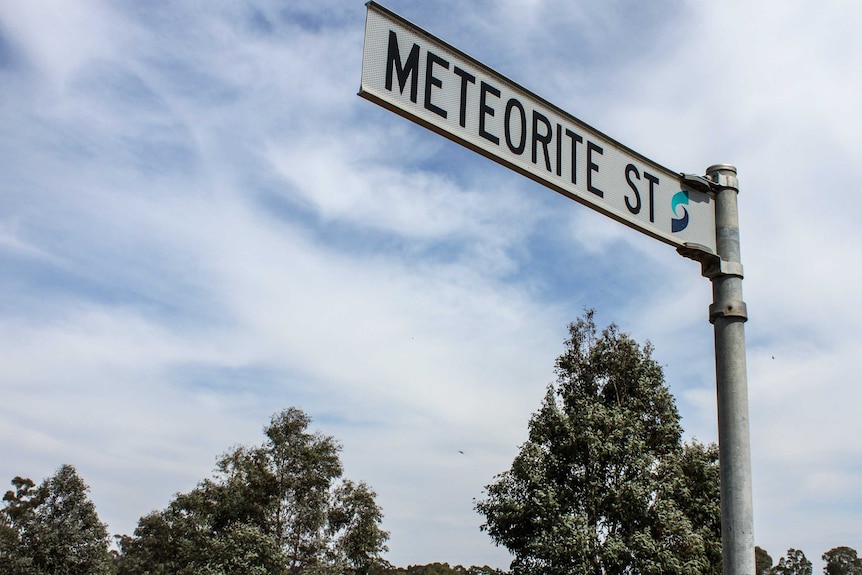 A street sign with 'meteorite st' written on it.