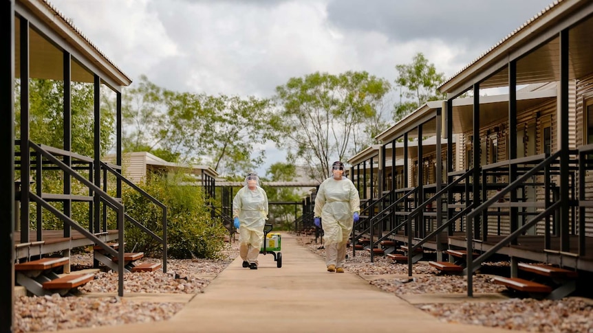 Specialist staff at the Howard Springs facility wear heavy PPE gear.