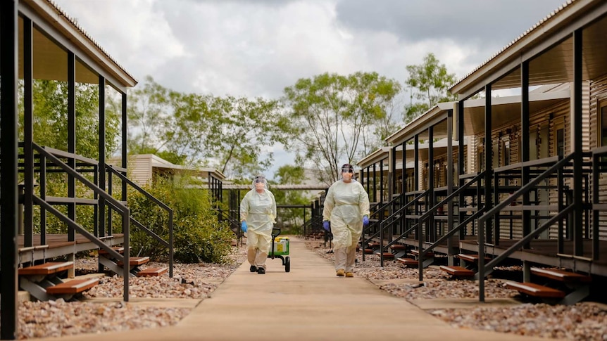 Specialist staff at the Howard Springs facility wear heavy PPE gear.