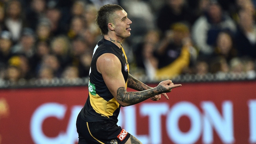 Dustin Martin of the Tigers reacts after kicking a goal