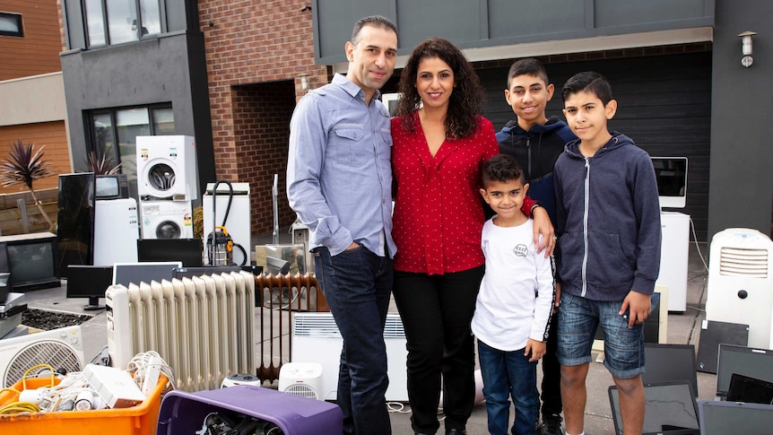 The Khoury Family with e-waste