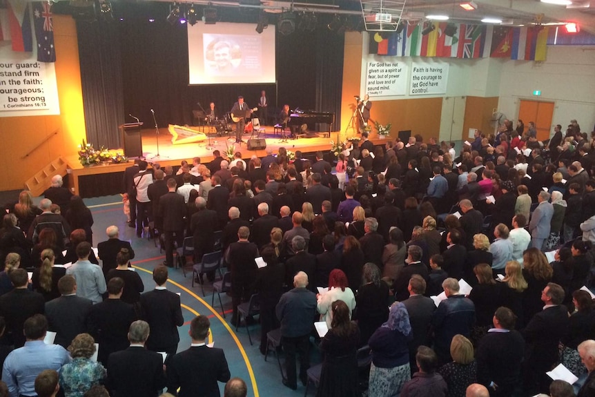 Mourners gather at the funeral of MH17 victim Victor Oreshkin in Sydney's south west.