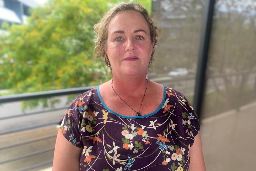 President of the Queensland Teachers' Union Cresta Richardson standing on a school balcony. 