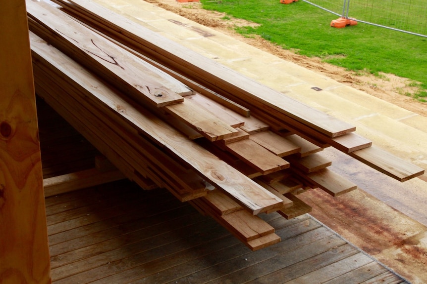 A bundle of treated yellow stringy bark ready to be used in the new building