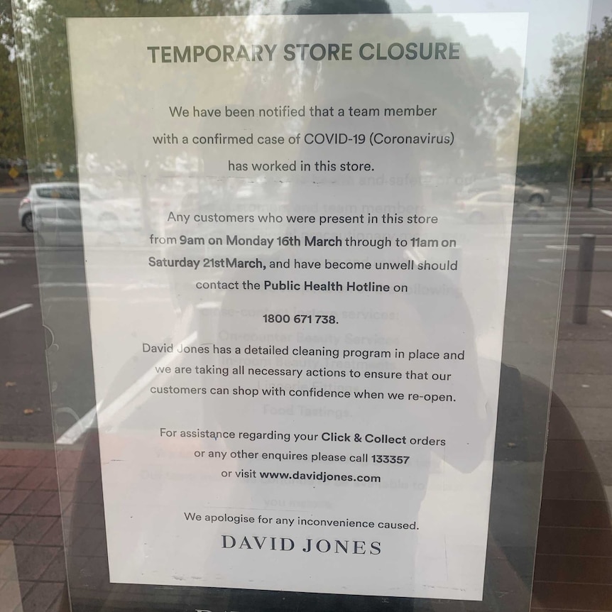 A white paper sign on a window at David Jones at the Marion shopping centre
