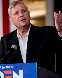 Tom Vilsack speaking at a campaign stop for presidential candidate Joe Biden in Iowa.