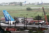 Rescuers at site of a plane crash at a Siberian airport, killing nearly 150 people.
