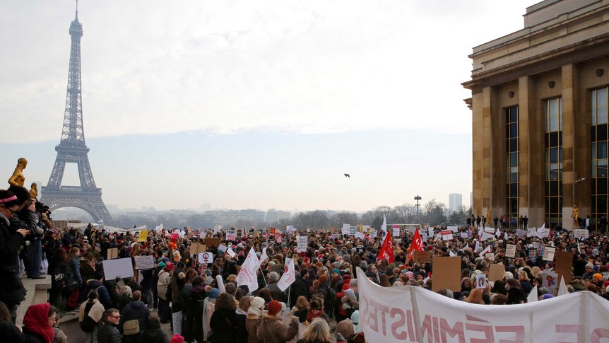 Crowds of protesters gather near Paris' Eiffel Tower