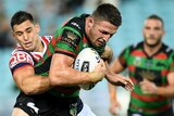 Sam Burgess runs through the Roosters defence