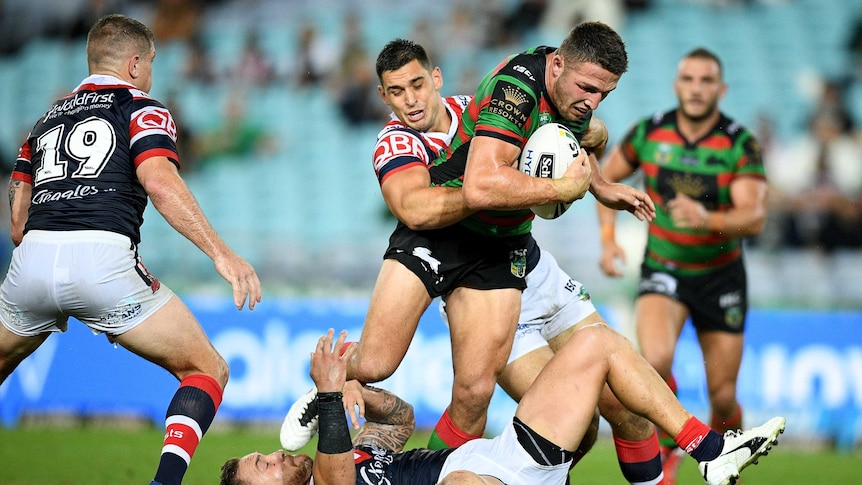 Sam Burgess runs through the Roosters defence