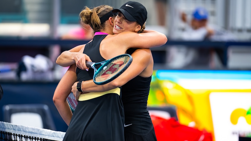 Aryna Sabalenka and Paul Badosa embrace after Miami Open match.