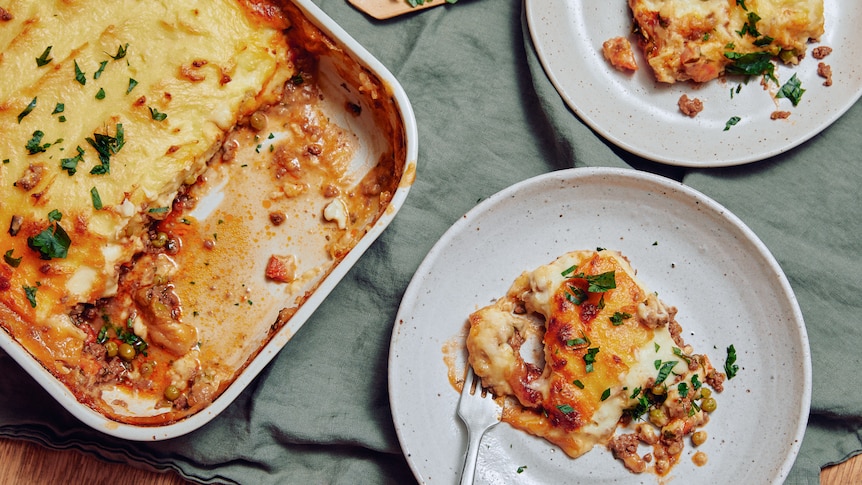 Picture of a tray of Shepherd's Pie, and slices on a plate.