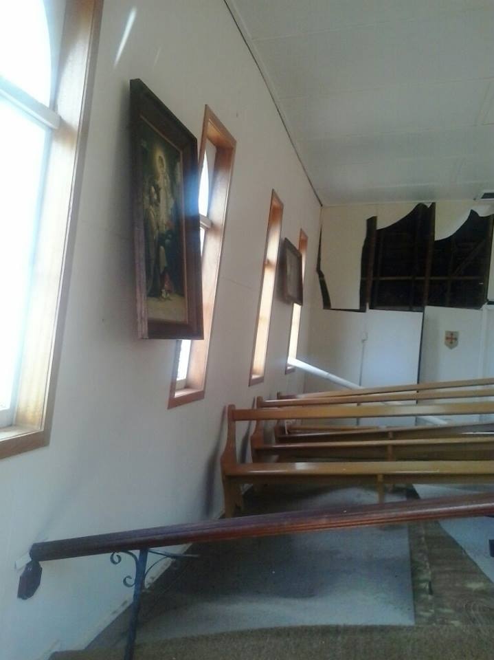 Destroyed pews inside the church.