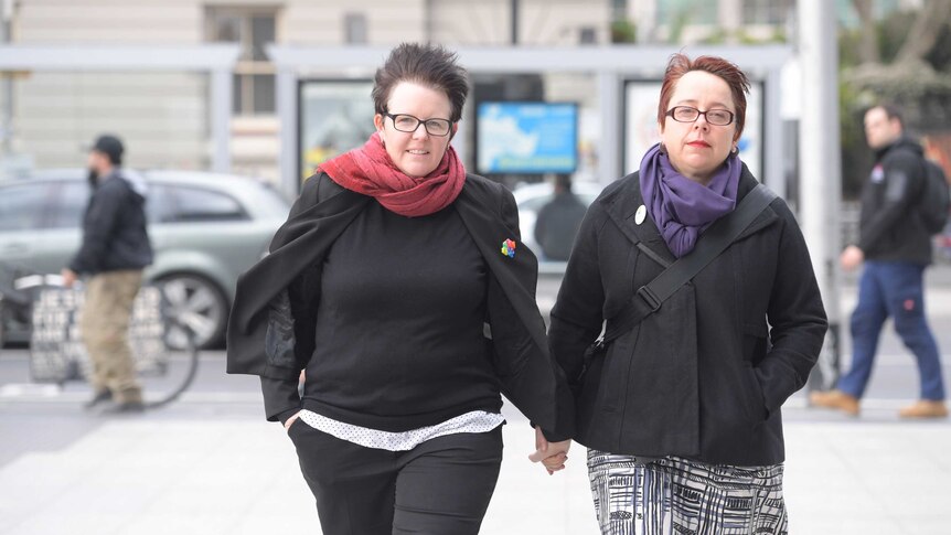 Felicity Marlowe and her partner Sarah Marlowe stand outside court in Melbourne.