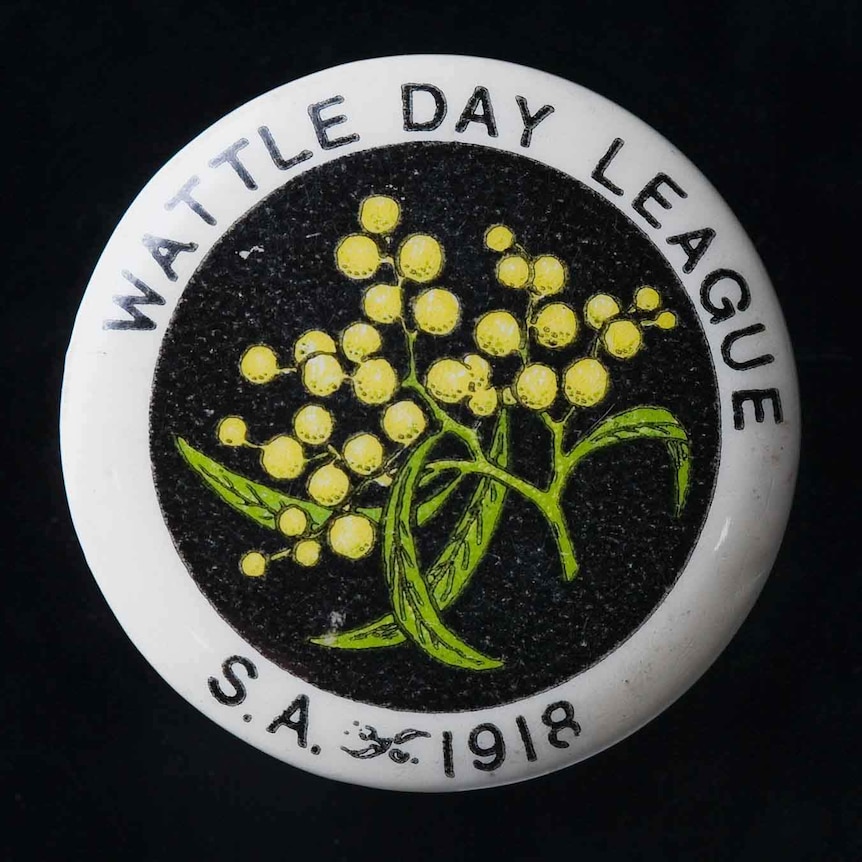 A badge with an image of a wattle.