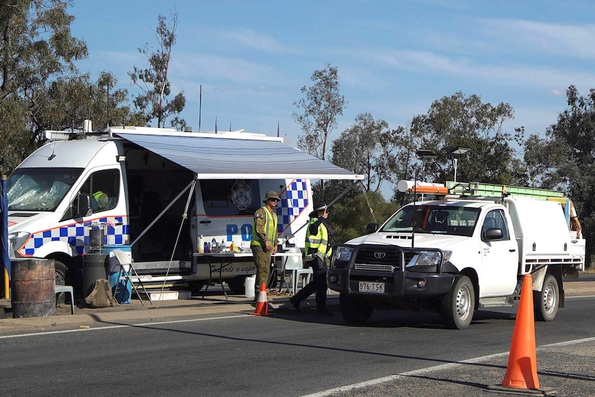 A police and army checkpoint at a rural border crossing