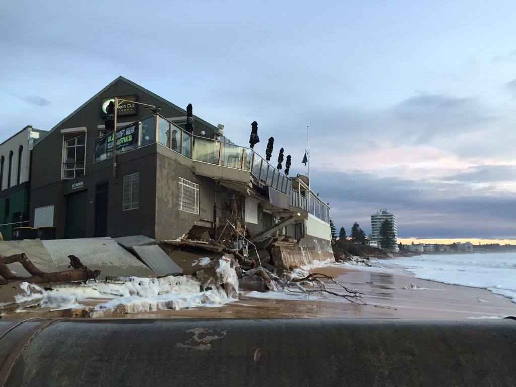 Debris and foam piled up against the beach club.