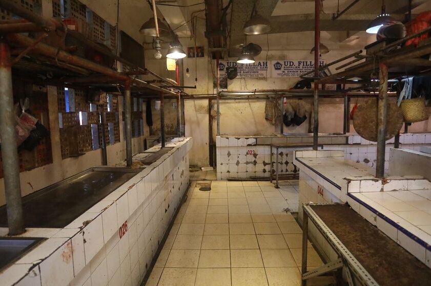 empty stalls at a wet market in Jakarta.