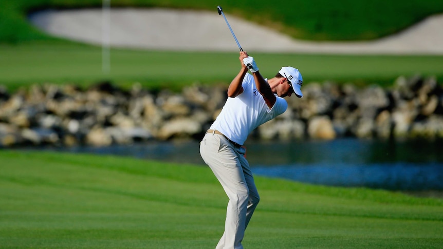 Australia's Adam Scott hits his second shot on the 18th in round three at Bay Hill.