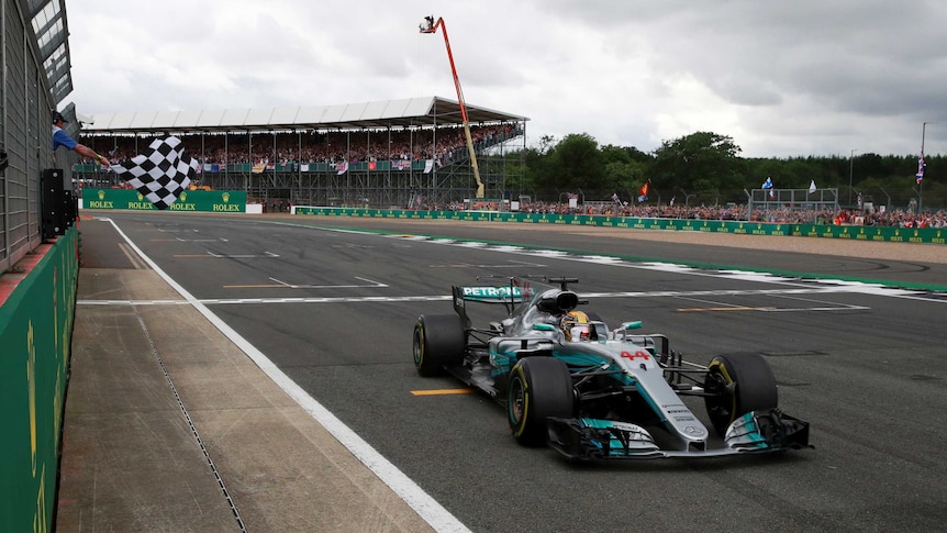 Lewis Hamilton crosses the finish line to win the 2017 British Formula One Grand Prix.