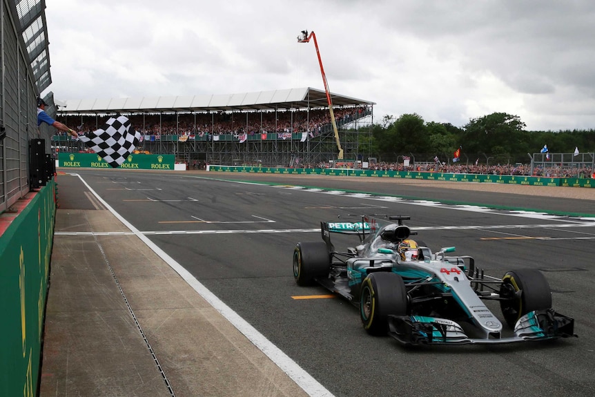 Lewis Hamilton crosses the finish line to win the 2017 British Formula One Grand Prix.