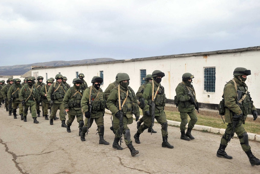 Armed men block access to a Ukrainian border base near Perevalne