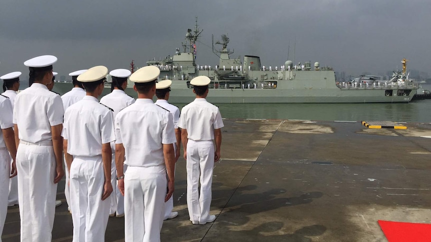 Members of the Chinese navy await the arrival of the Australian Navy at the port of Zhanjiang, in Guangdong province.