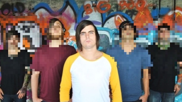 Band front man stands in front of fellow band members.