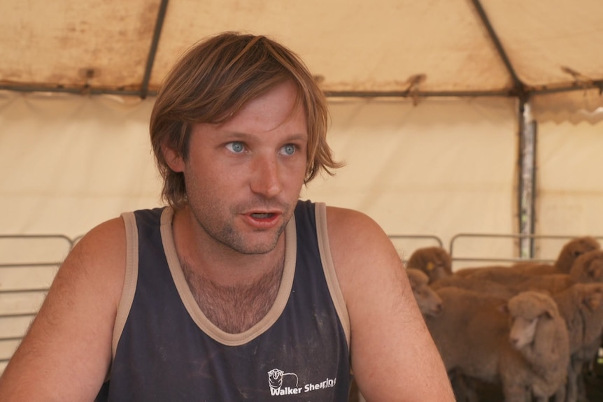 Photo of a younger man talking to the camera.