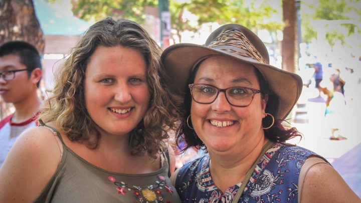 A mother and daughter stand together posing on the street in Tamworth