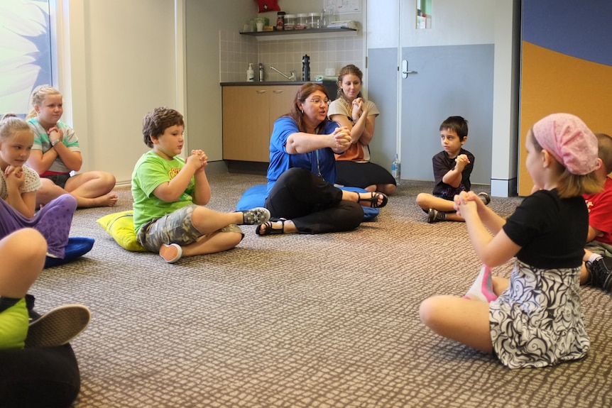 Shery Batchelor takes some children through a mindfulness exercise.