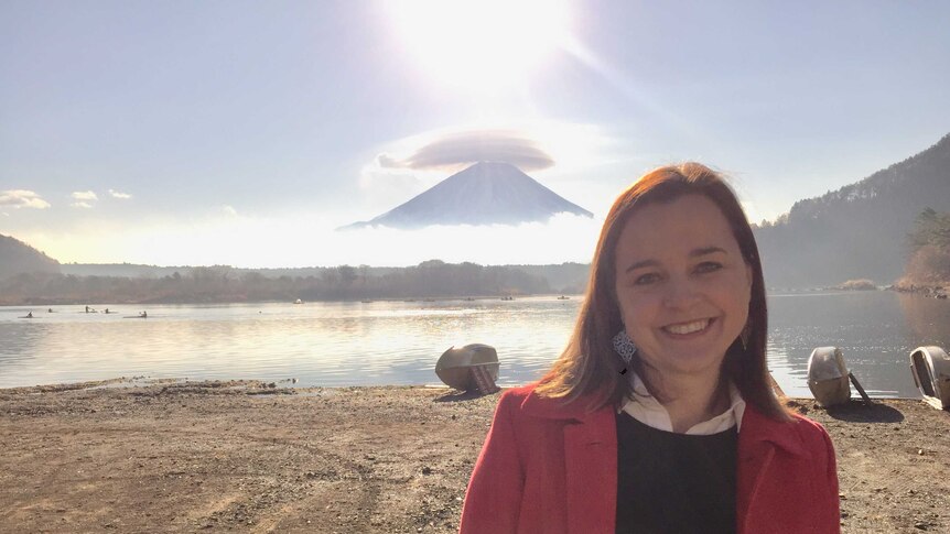 Rachel Mealey stands in front of Mt Fuji in Japan