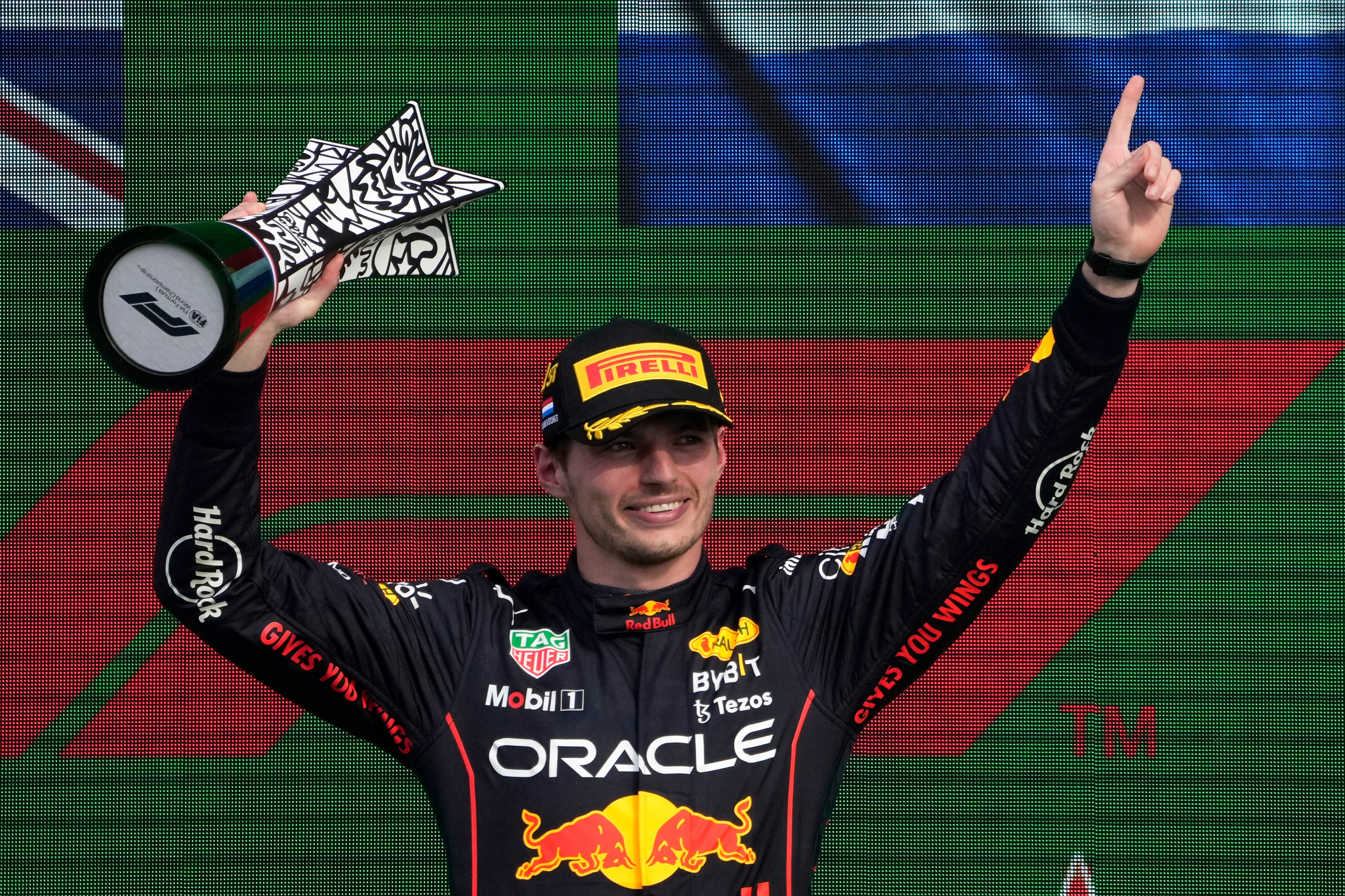 Max Verstappen lifts the trophy after winning the 2022 F1 Dutch Grand Prix