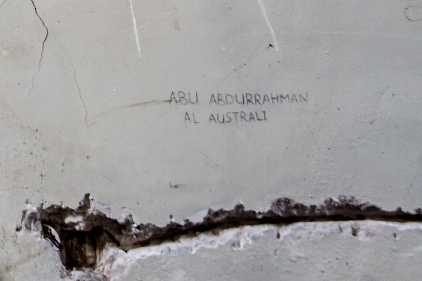 The text, written in English characters can be seen scrawled on the church wall.