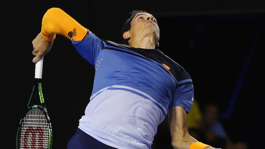 Sending down heat ... Milos Raonic serves to Gael Monfils during their quarter-final