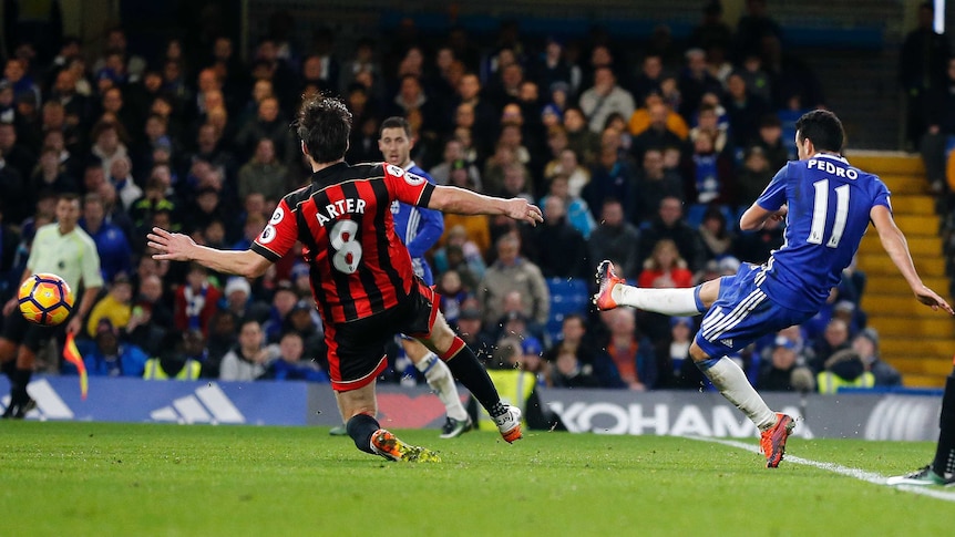 Chelsea's Pedro (R) scores against Bournemouth in Premier League match at Stamford Bridge.