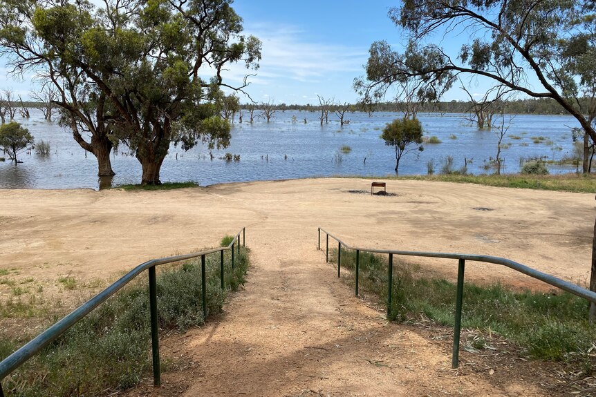 Water from a floodplain getting closer to a carpark and ramp. 