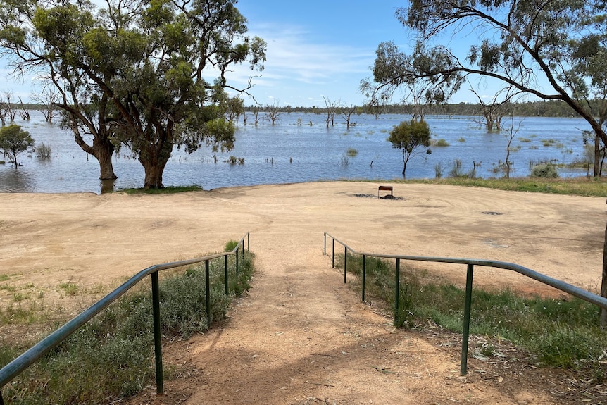 Water from a floodplain getting closer to a carpark and ramp. 