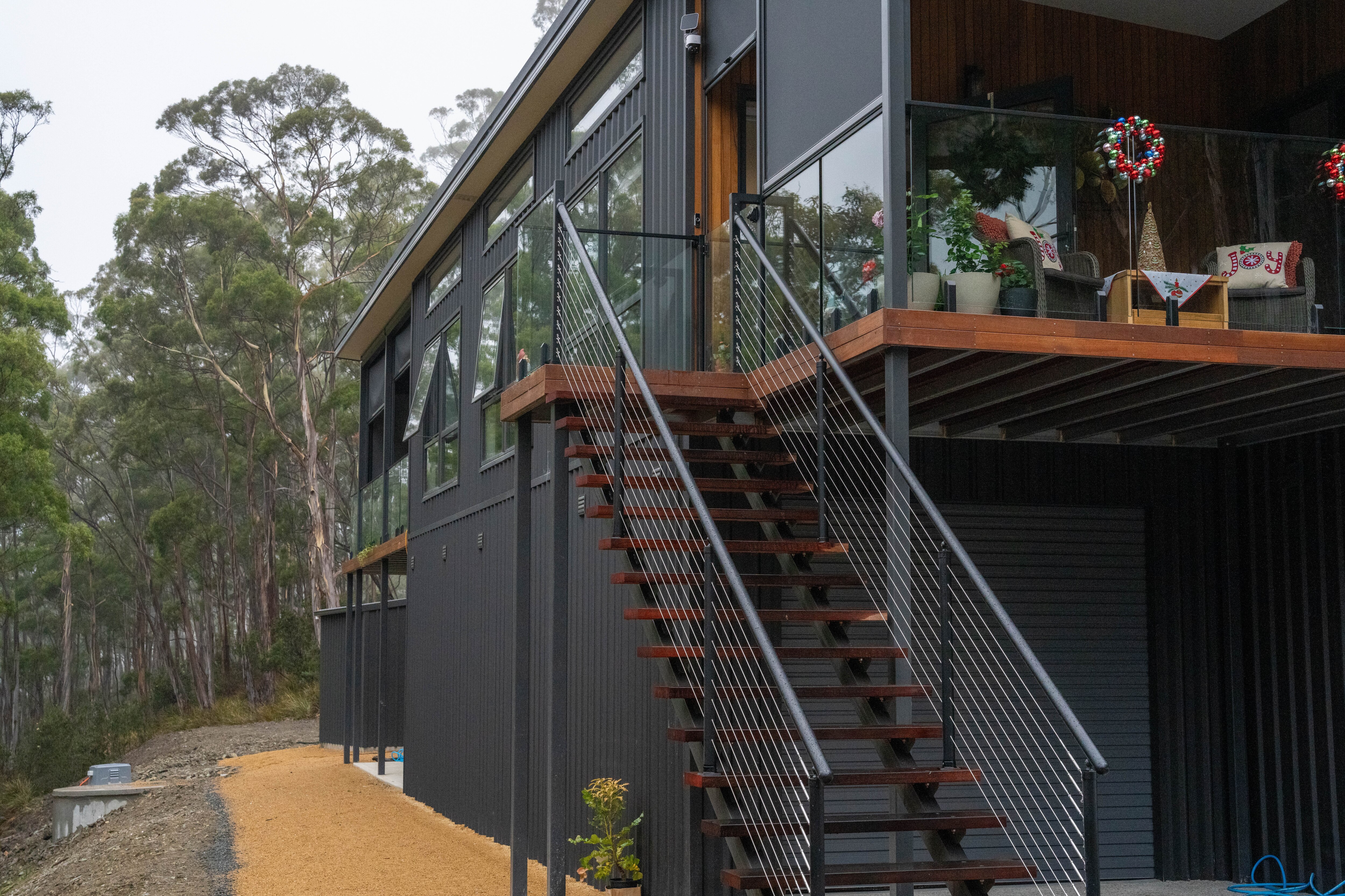 A house in the middles on a high tree top canopy
