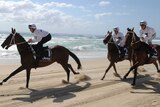 Horses run along the beach during the Magic Millions barrier draw at Surfers Paradise.