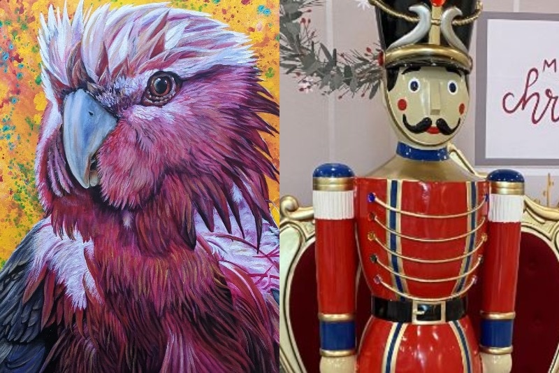 A painting of a galah next to a wooden nutcracker toy.