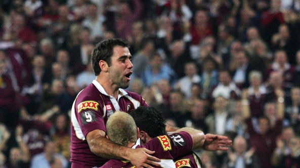 Cameron Smith, Michael Crocker and Darius Boyd of the Maroons celebrate Boyd's try