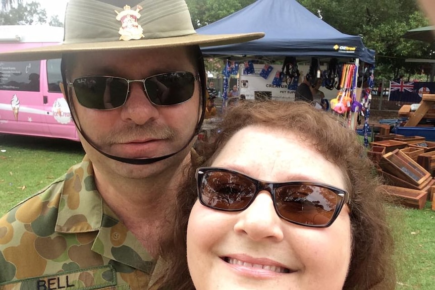 A self portrait of a man in uniform with his wife