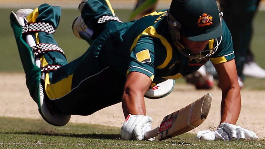 Australia's Usman Khawaja's bat is run out against Sri Lanka at the MCG.