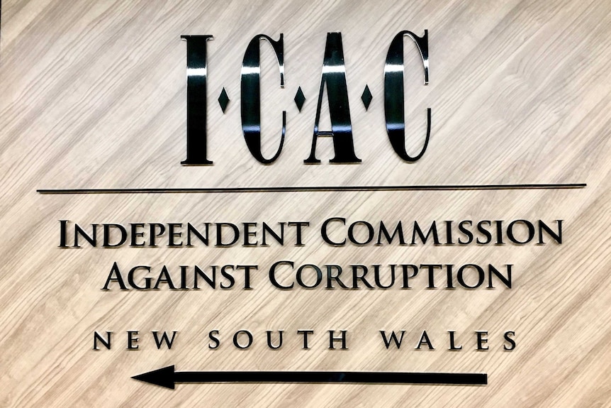 A sign says 'ICAC, Independent Commission Against Corruption'