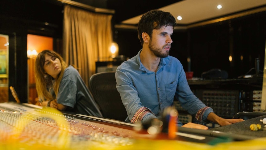 Tasmanian performer Maddy Jane in the recording studio with unidentified sound engineer.