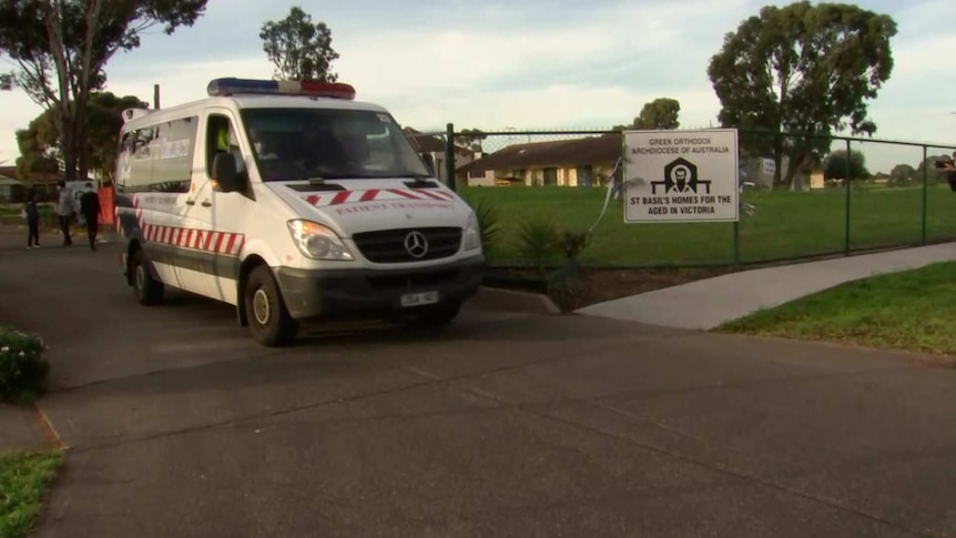 An ambulance pulls out of the driveway of St Basil's aged care home.