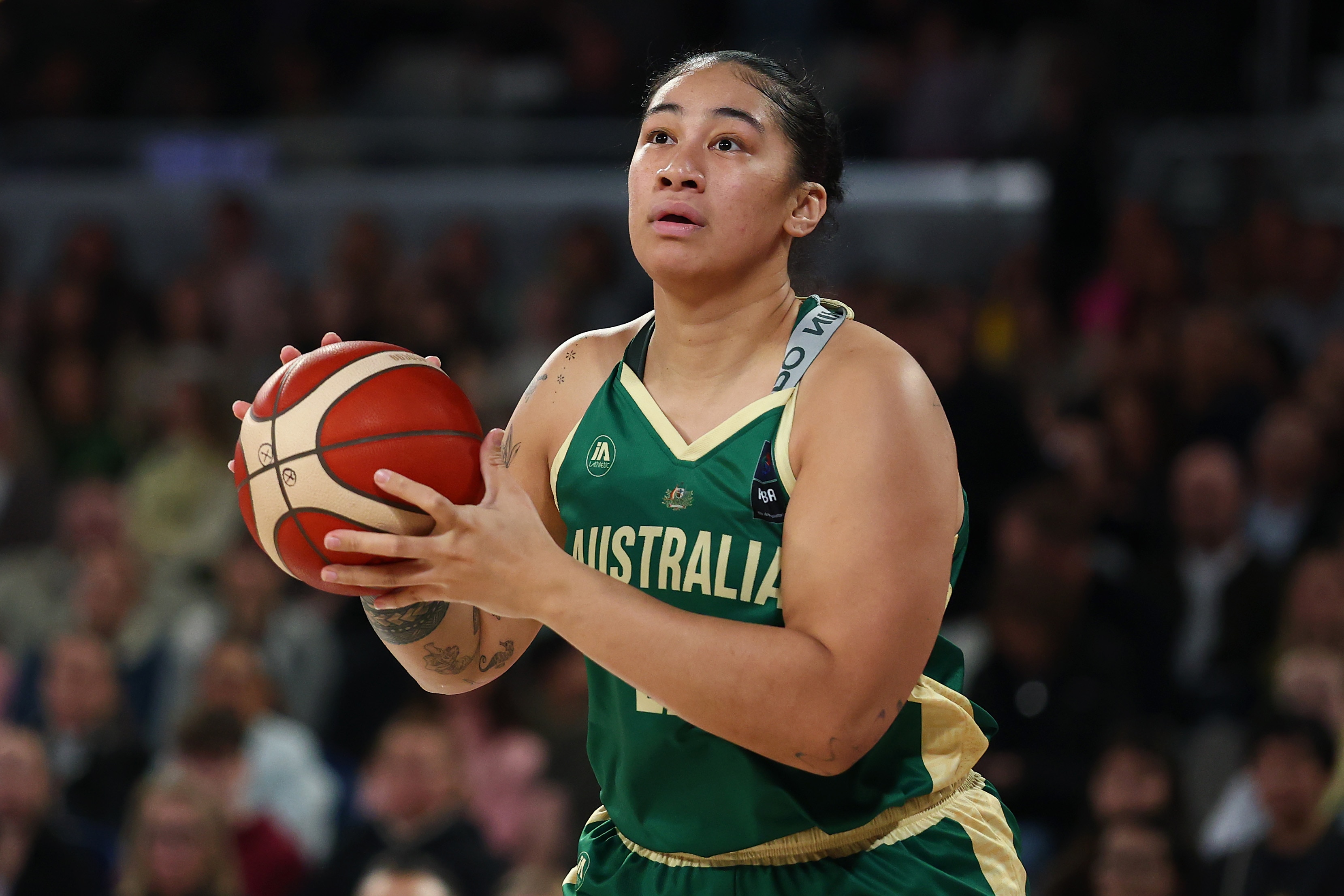 Australian basketballer Zitina Aokuso prepares to pass the ball during a game